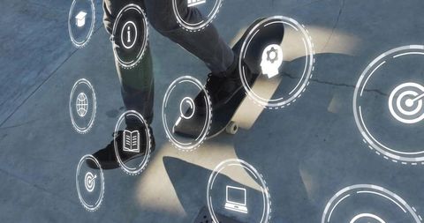 Balancing male skateboarder legs on urban plaza with floating digital interface icons