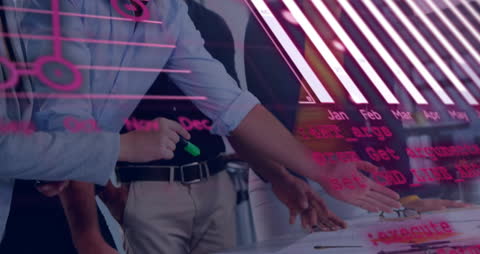 Business Team Analyzing Interactive Financial Data Interface