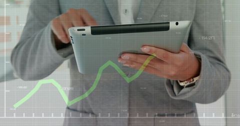 Businesswoman Holding Tablet Displaying Upward Growth Chart and Digital Analytics