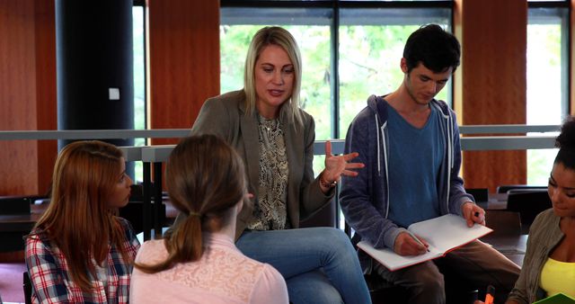 Female Tutor Engaging with Students in Study Group Session - Download Free Stock Images Pikwizard.com