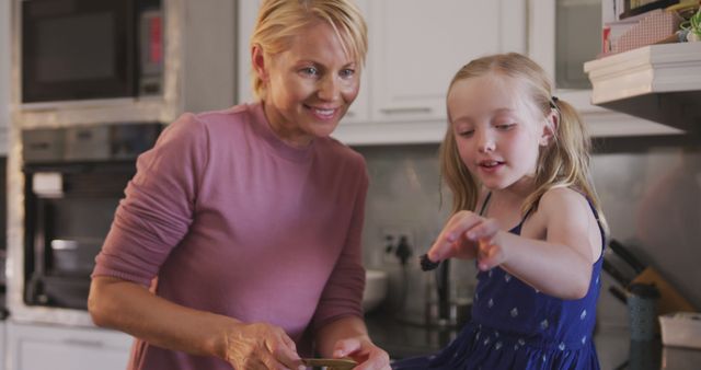 Grandmother and Young Girl Baking Together in Kitchen - Download Free Stock Images Pikwizard.com
