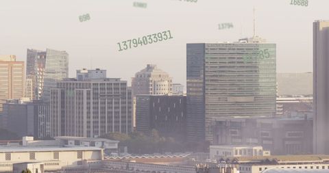 Rising numbers over modern cityscape representing digital growth