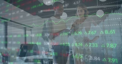 Diverse businesswomen analyzing financial trends in modern office