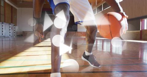 Dynamic Athlete Dribbling Basketball on Vibrant Indoor Court