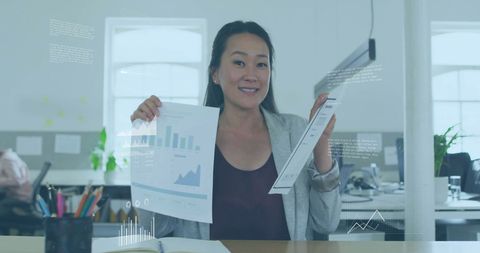 Businesswoman Analyzing Charts with Digital Data Interface