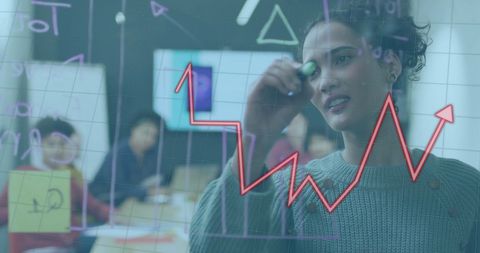 Businesswoman Analyzing Graph on Transparent Screen Team Meeting - Download Free Stock Images Pikwizard.com