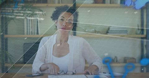 Businesswoman Preparing at Modern Home Office with Digital Overlay