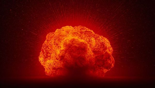 Dramatic Orange-Red Mushroom Cloud in Dark Atmospheric Setting