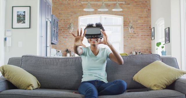 Smiling Woman Using VR Headset in Modern Living Room - Download Free Stock Images Pikwizard.com