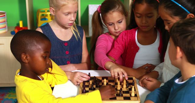 Preschool class learning how to play chess in playschool