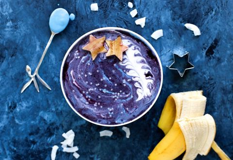 Starry night smoothie with blue swirls and fruit