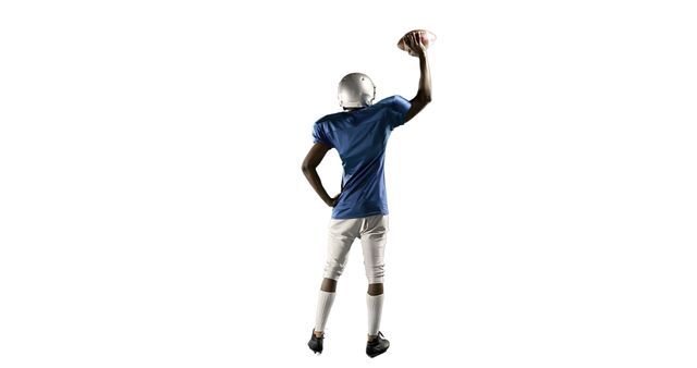 Confident Football Player Holding Ball Up High in Victory Pose - Download Free Stock Images Pikwizard.com