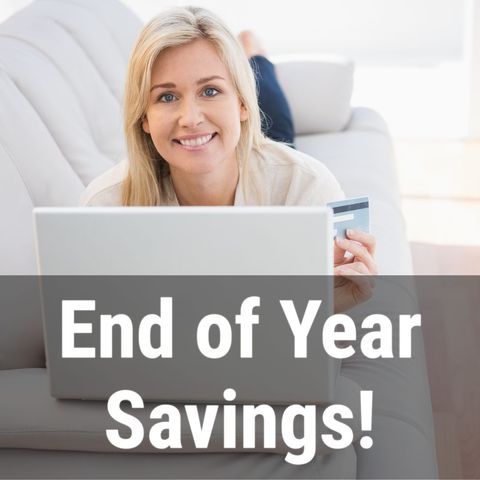 smiling woman online shopping during end of year sale - Download Free Stock Templates Pikwizard.com