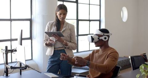 Diverse Team Collaborating with Virtual Reality Tech in Modern Office