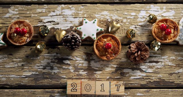 Christmas decorations and 2017 on wooden background with copy space. Christmas, new year, celebration and tradition concept.