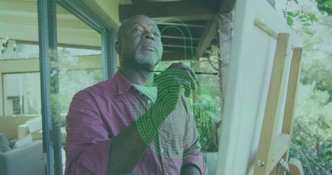 Senior Artist Painting on Outdoor Deck in Nature
