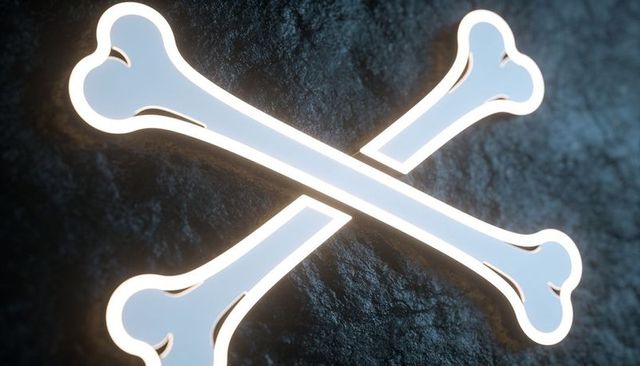 Glowing crossed bones emblem emitting warm rim glow on rough stone for danger branding