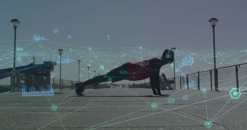 Fit man doing outdoor push-ups with network graphics