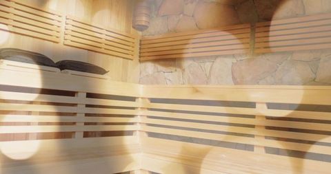 Relaxing wooden sauna interior with slatted benches and warm ambient glow