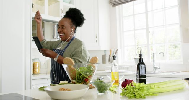 Joyful Woman Cooking Healthy Meal in Modern Kitchen - Download Free Stock Images Pikwizard.com