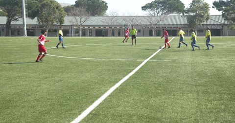 Soccer Players Strategizing on Field Before Match