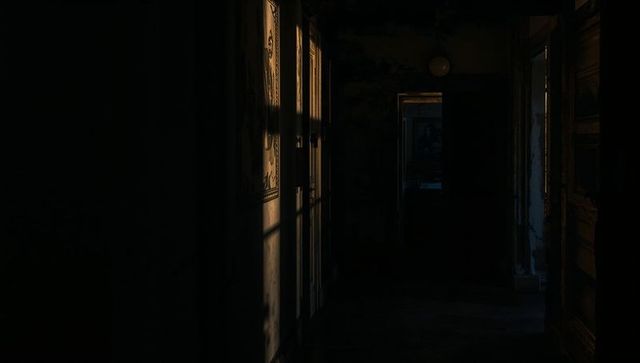 Dimly Lit Corridor in Abandoned Building with Rustic Charm