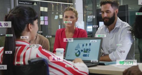 Presenting team collaborating on data dashboard with social metrics overlays in glass room