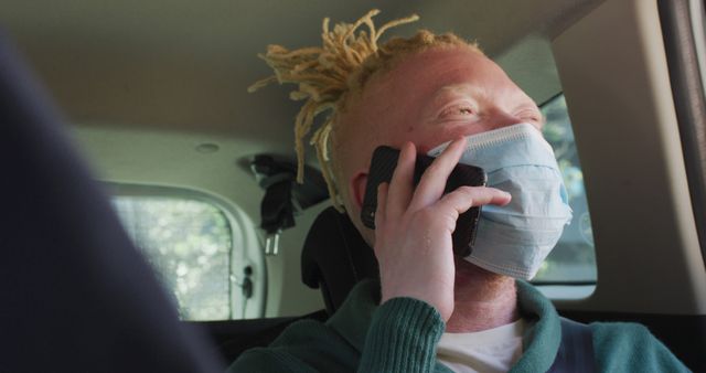 Person with Face Mask Using Phone While Sitting in Car - Download Free Stock Images Pikwizard.com