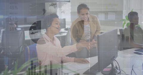 Diverse Colleagues Collaborating with Data Technology in Modern Office