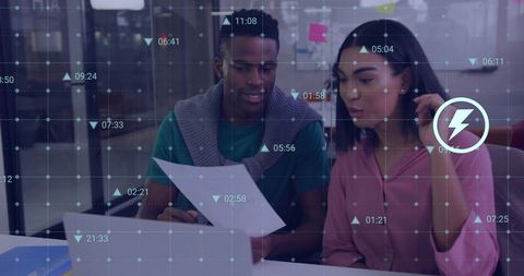 Diverse professionals analyzing financial data interface in modern office
