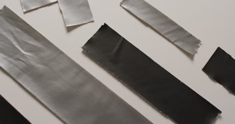 Textured Utility Tapes on Neutral Backdrop: Industrial Material Focus