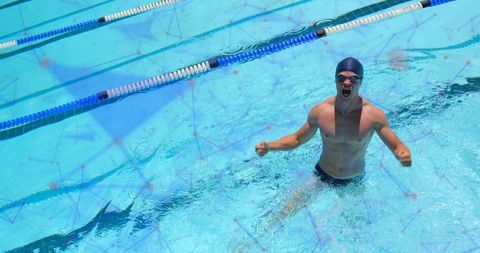 Triumphant Male Swimmer Celebrating in Pool