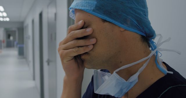 Exhausted Healthcare Worker Taking Break in Hospital Corridor - Download Free Stock Images Pikwizard.com