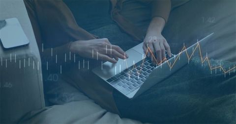 Woman Analyzing Stock Market Trends at Home on Laptop