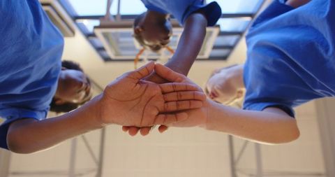 Diverse Female Youth Team Demonstrates Unity and Teamwork in Sports Setting