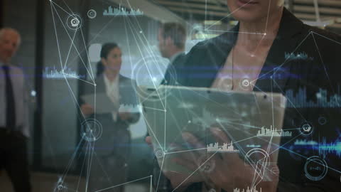 Business Professional Using Tablet in Modern Office with Data Graphics