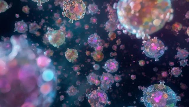 Glowing translucent virus-like particles floating in sparkling microscopic bokeh field