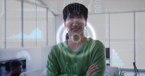 Korean tech professional smiling with crossed arms, round glasses, green sweater with hud overlay