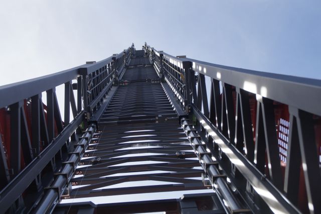 Looking Up Industrial Metal Ladder Against Blue Sky - Download Free Stock Photos Pikwizard.com
