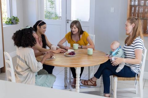 Diverse Women Socializing in Cozy Kitchen Environment