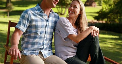 Middle-Aged Couple Smiling Together on Park Bench - Download Free Stock Images Pikwizard.com