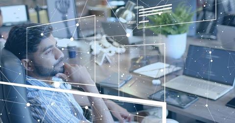 Focused professional analyzes data in high-tech office