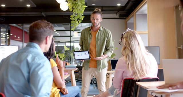 Casual Team Meeting with Male Presenter in Office - Download Free Stock Images Pikwizard.com