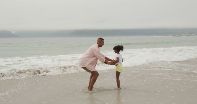 Father and Daughter Playing on the Beach at Sunset - Download Free Stock Images Pikwizard.com