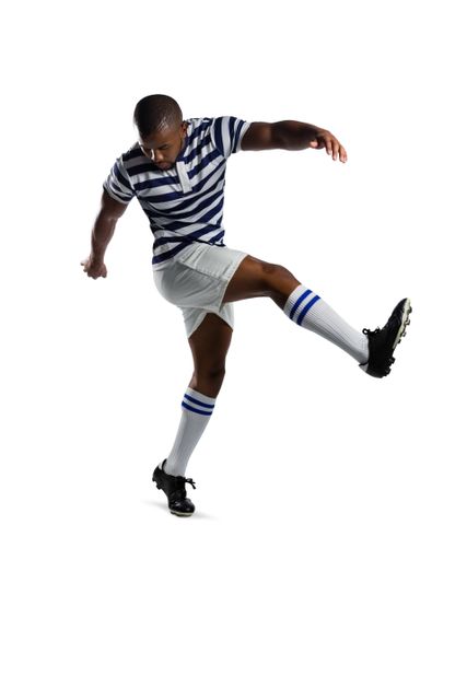 Male rugby player in action, kicking ball on white background. Ideal for sports-related content, athletic training materials, fitness promotions, and team sport advertisements.