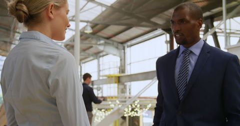 Business Meeting in Industrial Factory Setting