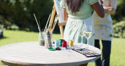 Artistic Garden Gathering with Painting and Wine