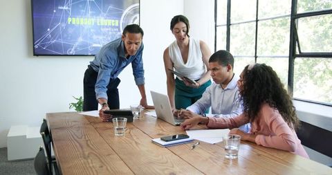 Diverse Team Collaborating During Successful Business Meeting