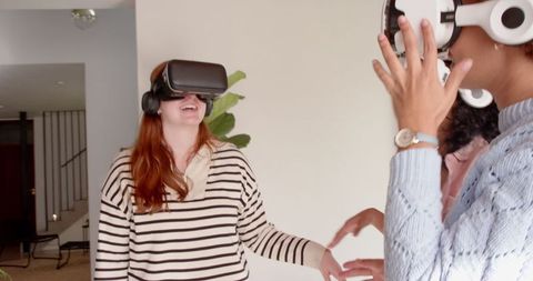Diverse Group of Friends Exploring Virtual Reality Indoors