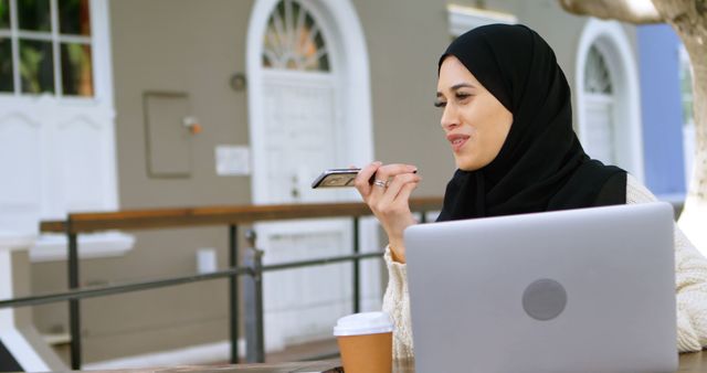 Young Muslim Businesswoman Speaking on Phone in Outdoor Workspace - Download Free Stock Images Pikwizard.com